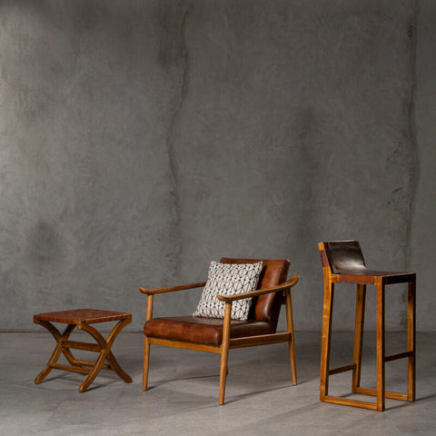 Brown woven leather armchair with wooden frame and patterned cushion from kendari brown woven collection