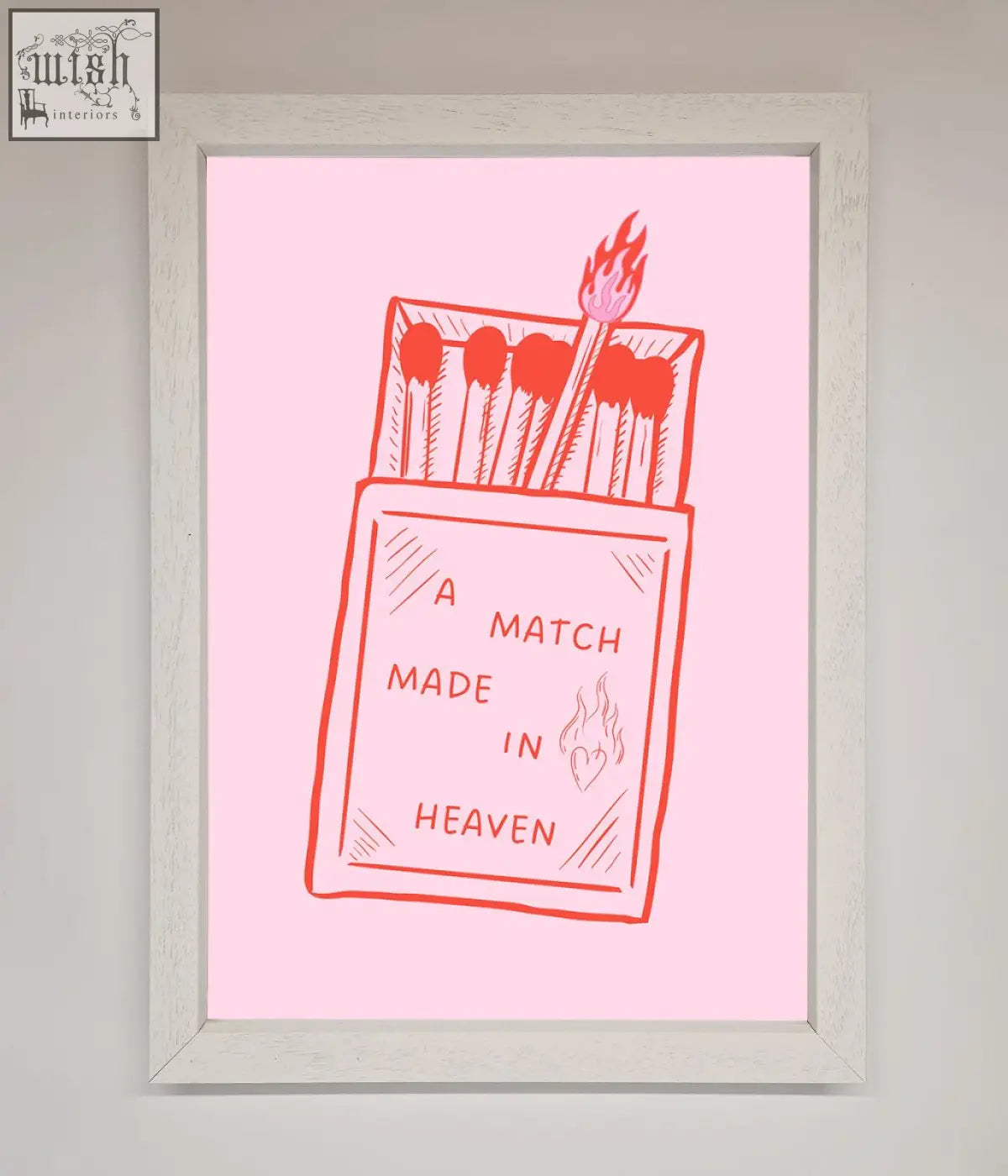 A pink match made in heaven framed wall art featuring an open matchbox with one lit match in a white frame