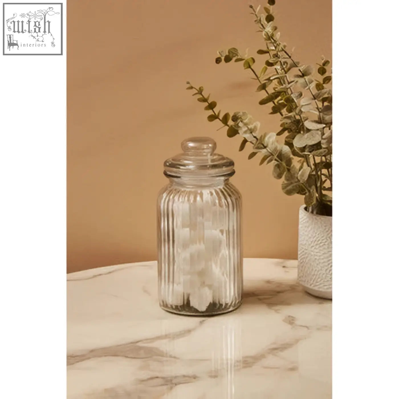 Clear abbie ribbed glass storage jar 1300 ml filled with white cotton balls with matching lid for glass storage