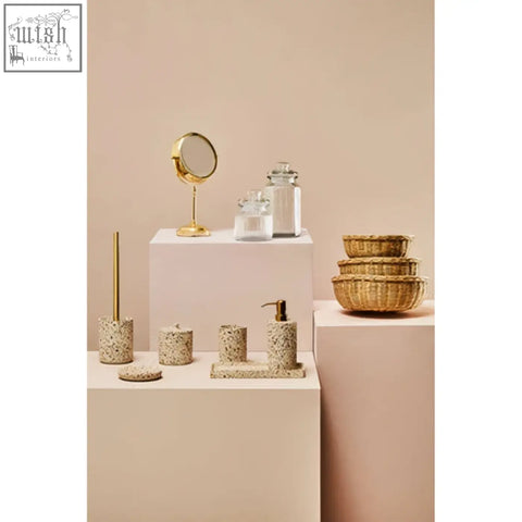 Gold-finished round vanity mirror with slender stand next to abbie ribbed glass storage jar 1300 ml for glass storage