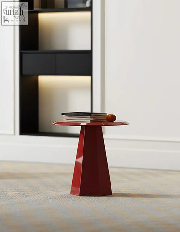 The abbott side table red is a sleek glossy geometric table with a conical base perfect for any coffee table set