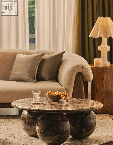 Abdurrahman round marble coffee table with polished dark brown and black veined top and three spherical bases