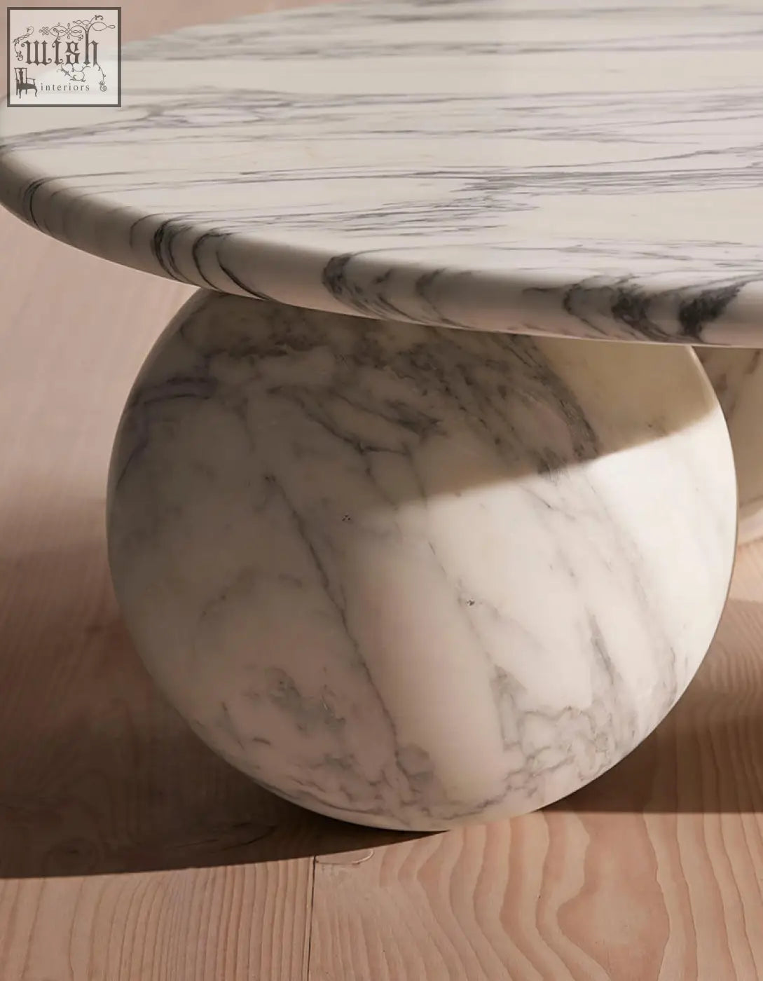 Abdurrahman round coffee table all marble with smooth white surface and gray veining on a matching marble base