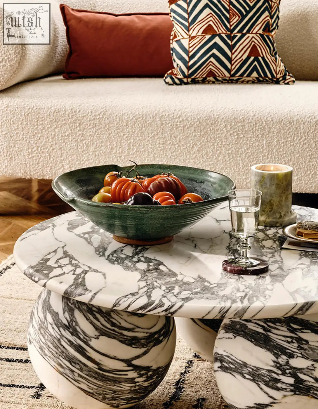 Abdurrahman round coffee table with sleek white and black marble top and rounded organic marble legs coffee table
