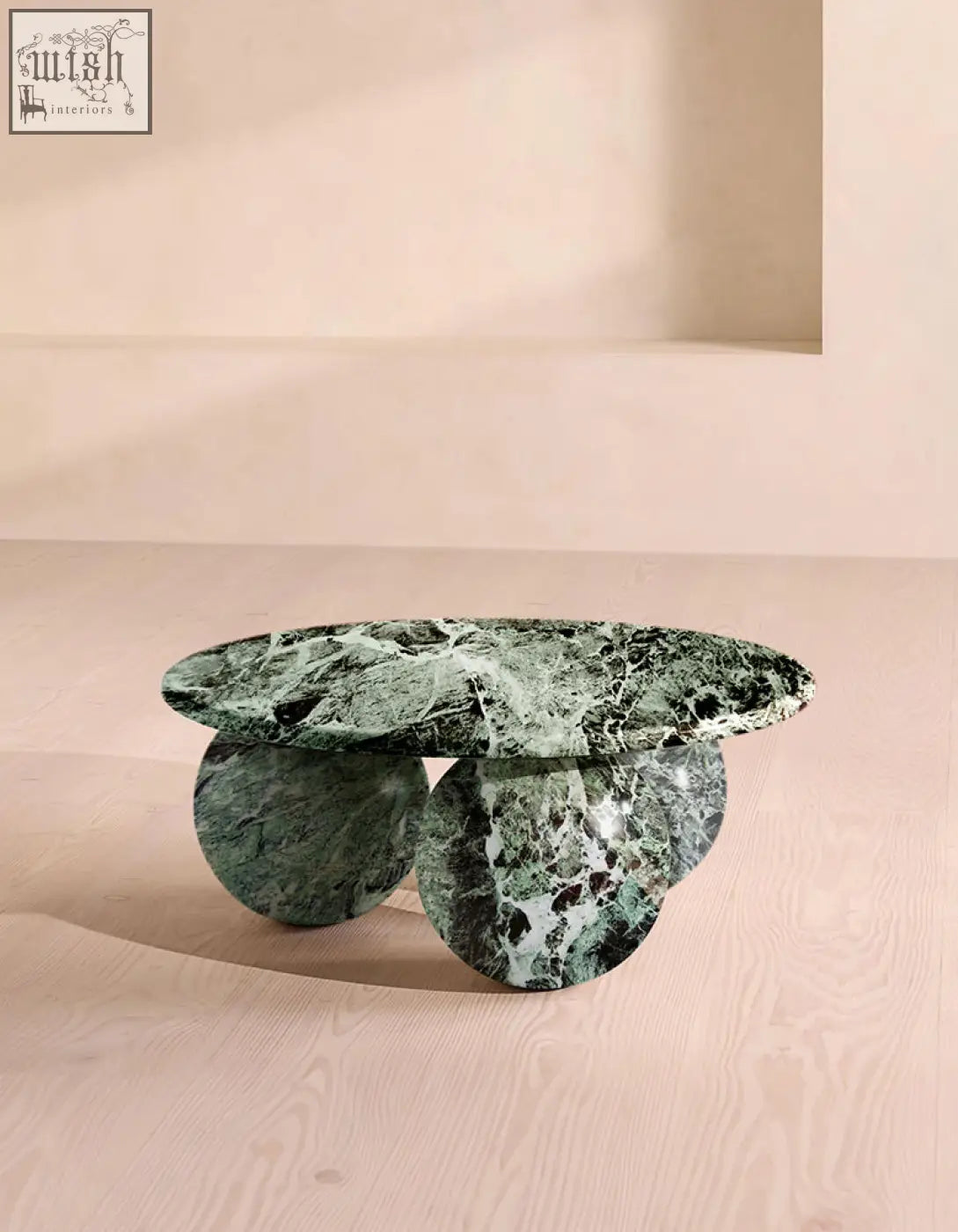 Abdurrahman round coffee table is a dark green marble coffee table with an oval top and matching circular marble legs