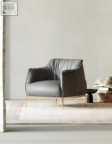 Abelard armchair leather in gray with gold-tone metal legs and subtle stitching details offer financing and low shipping cost