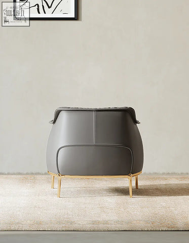 Abelard armchair in gray leather with gold-tone metal legs and sleek design available with offer financing and shipping cost options