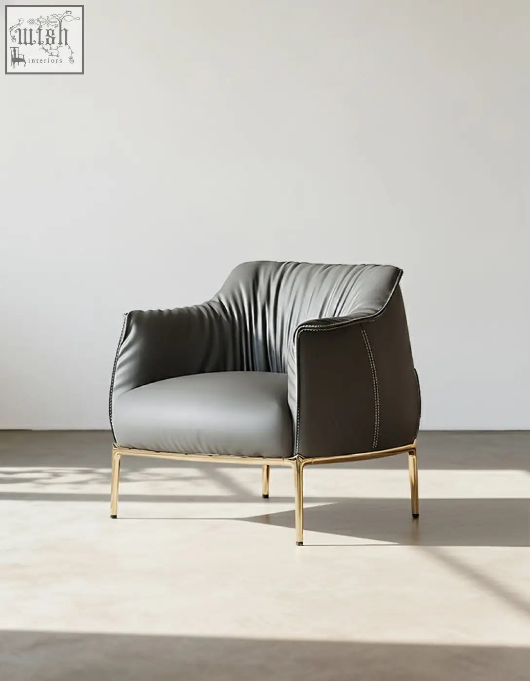 Abelard armchair leather offers sleek dark gray leather and gold legs with financing and affordable shipping cost options