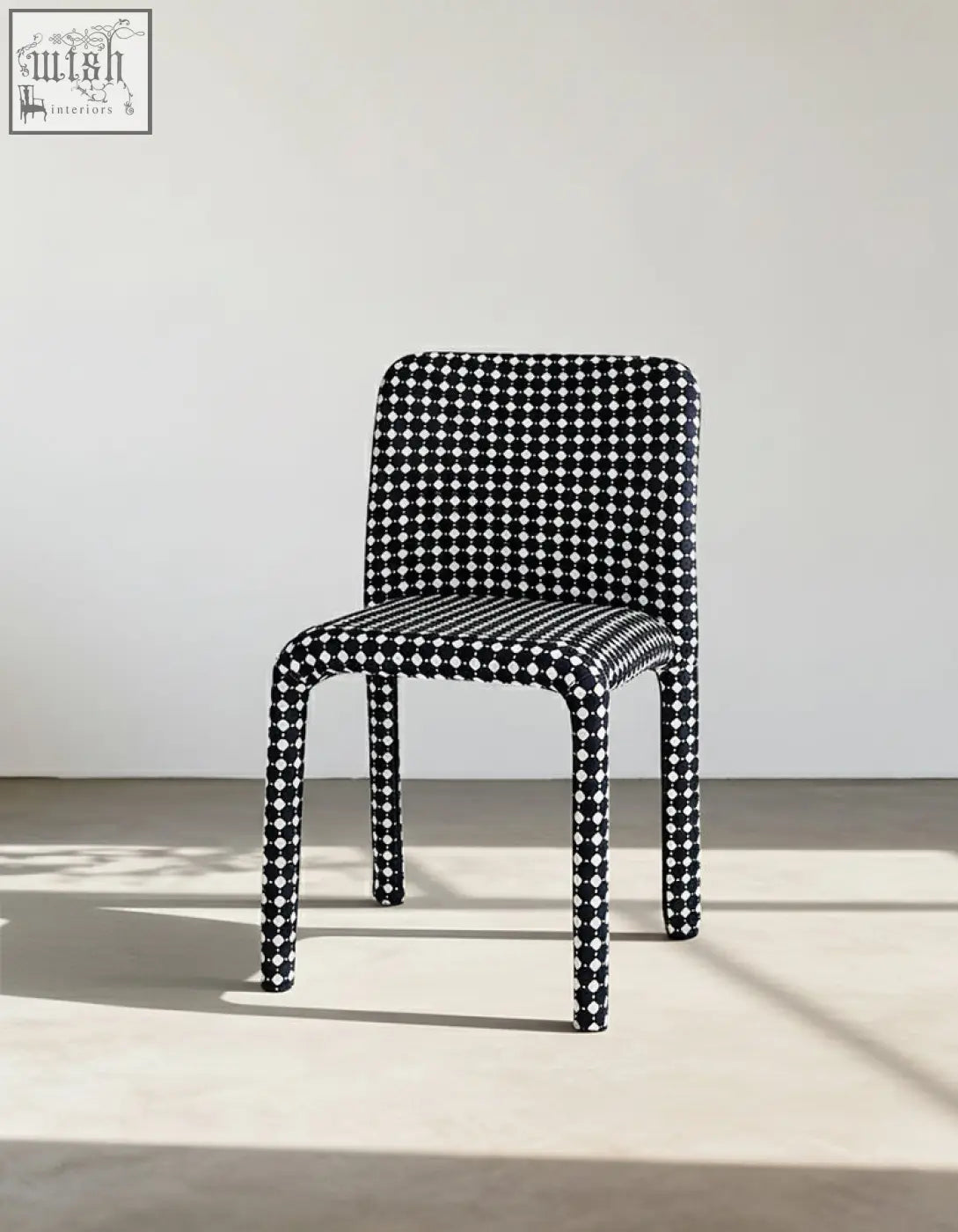 Abelson dining chair velvet with black and white polka-dotted upholstery perfect for your coffee table set seating