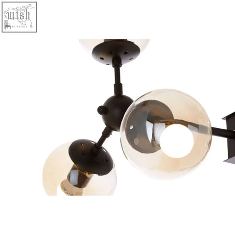 Matte black pendant light abira with six arms and three spherical glass shades in black metal design