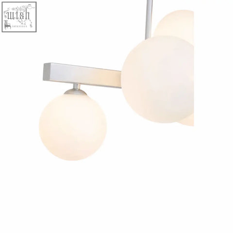 Modern minimalist abira chrome pendant lamp with three frosted glass globe shades on sleek chrome metal arm