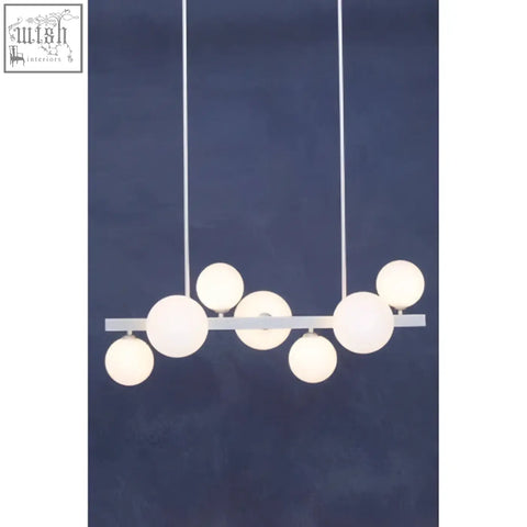 Modern white pendant lamp with spherical glass bulbs hanging from a sleek chrome pendant bar for stylish lighting