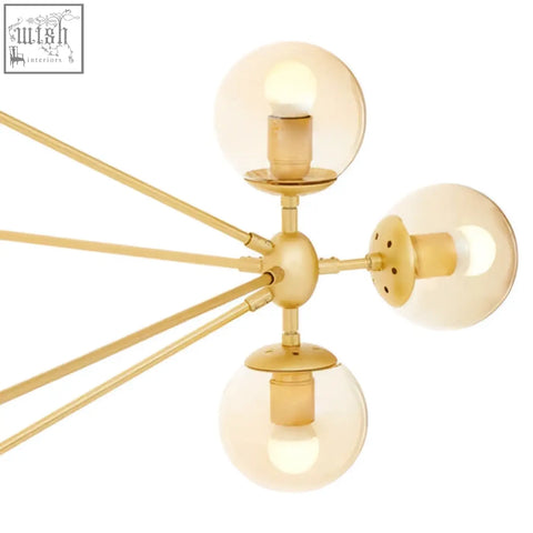 Abira fifteen arm gold finish pendant light with three spherical glass bulbs and slender metallic arms arm pendant light