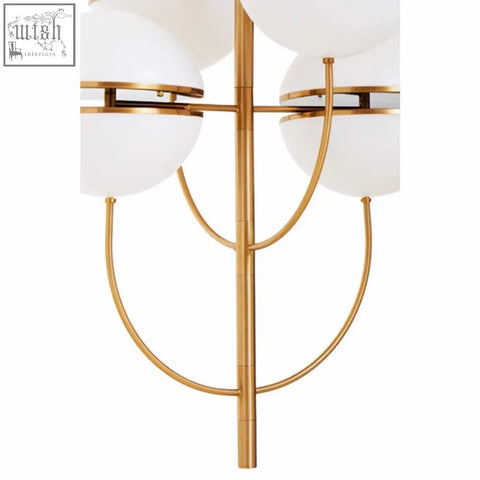 Gold-toned abira four ball brass pendant light with frosted white spherical glass shades for stylish lighting
