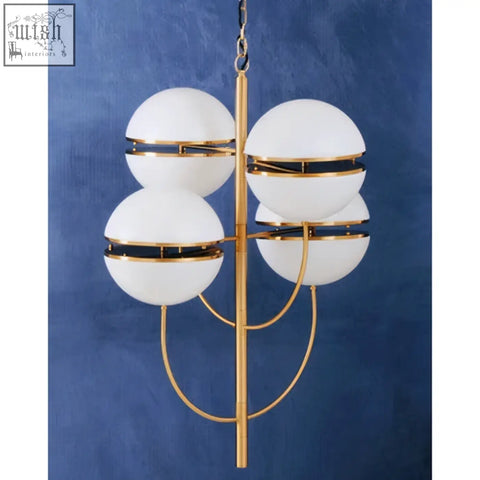 Abira four ball brass pendant light with gold-toned frame and four frosted white spherical shades with black bands
