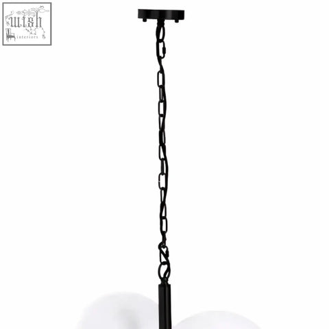Black metal chain with a matte finish hanging from ceiling for abira four ball matt black pendant light