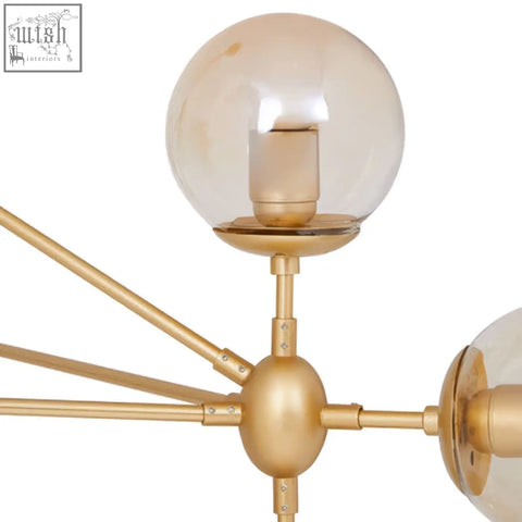 Abira gold 10 arm pendant light with gold-toned frame and spherical amber glass shades arm pendant light