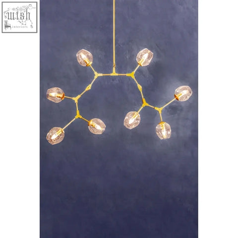 Abira light gold 8 arm pendant lamp with gold-toned chandelier and faceted crystal bulbs in tree-like design