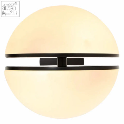 Cream-colored spherical abira matt black ball wall light with sleek black horizontal band across center