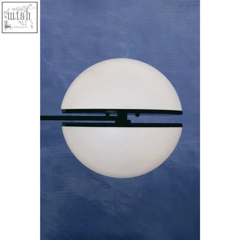 Abira matt black ball wall light with white globe and black horizontal bar accent for modern lighting