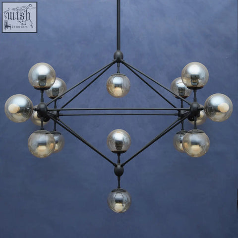 Modern black metal chandelier with reflective silver glass globes in a geometric molecular design abira matte black 21 arm pendant lamp