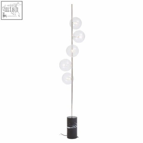 Abira nickel and black marble floor lamp with slender pole and five glass globes on a black marble base