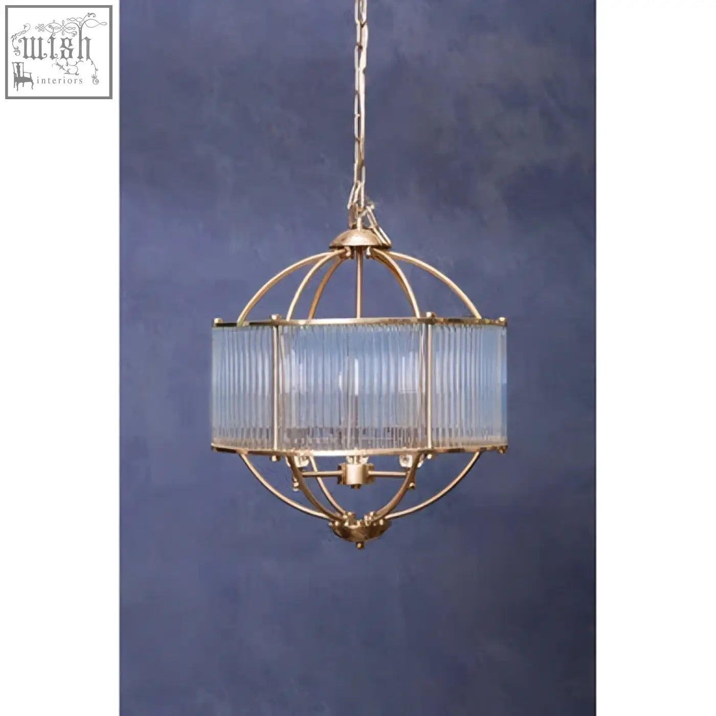 Gold-toned abira pendant light with cage-style design and vertical ribbed glass shade for stylish lighting
