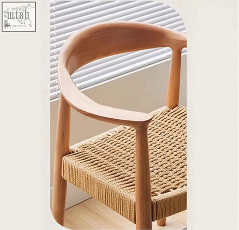 Light wood framed abiram rattan dining chair with woven natural fiber seat perfect for dining spaces