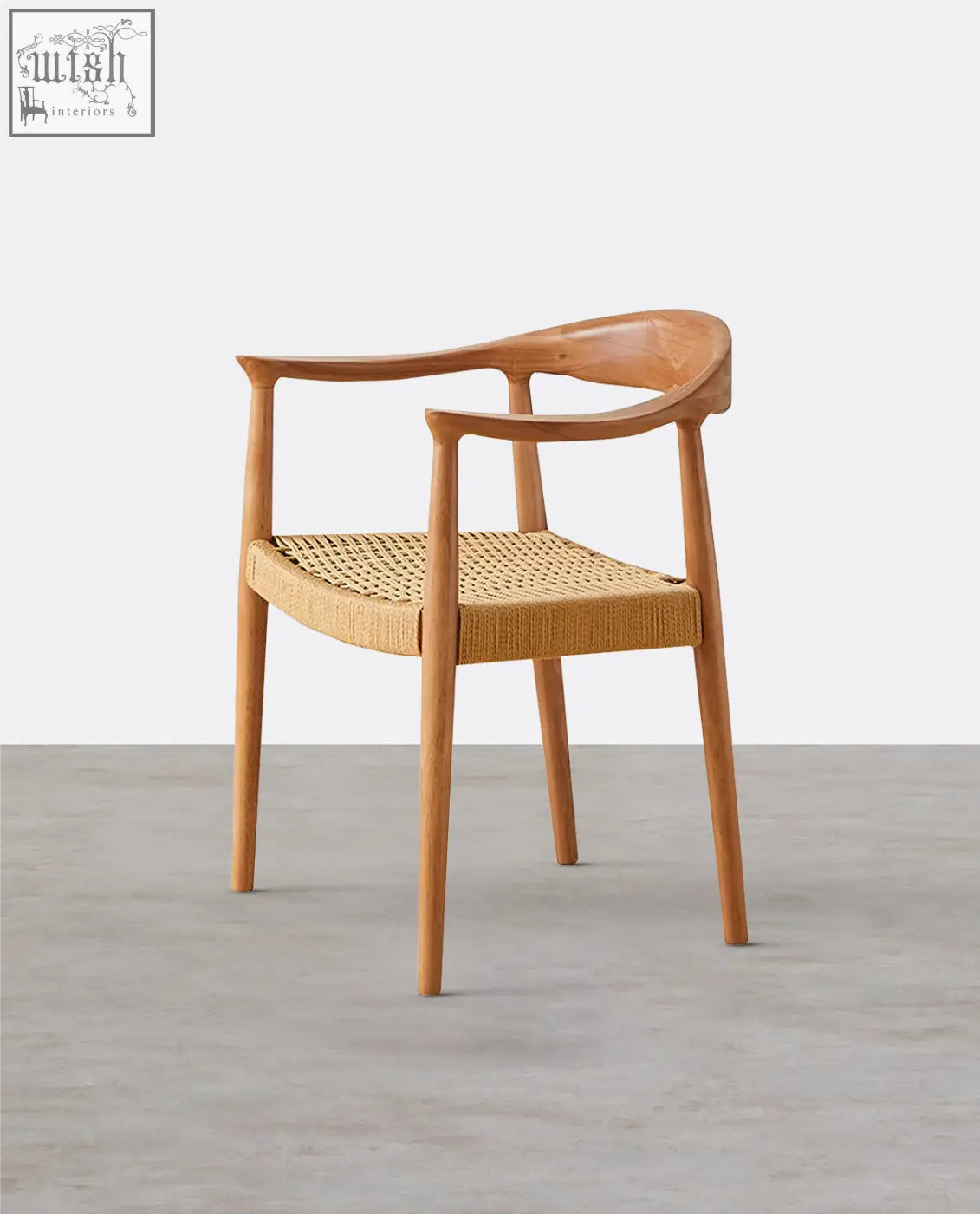 Abiram rattan dining chair with a minimalist light wood frame and woven wicker seat perfect for dining rooms