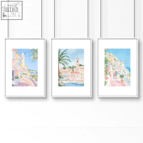 Set of 3 framed watercolor wall art prints of mediterranean towns in pastel hues perfect for bed wall decor