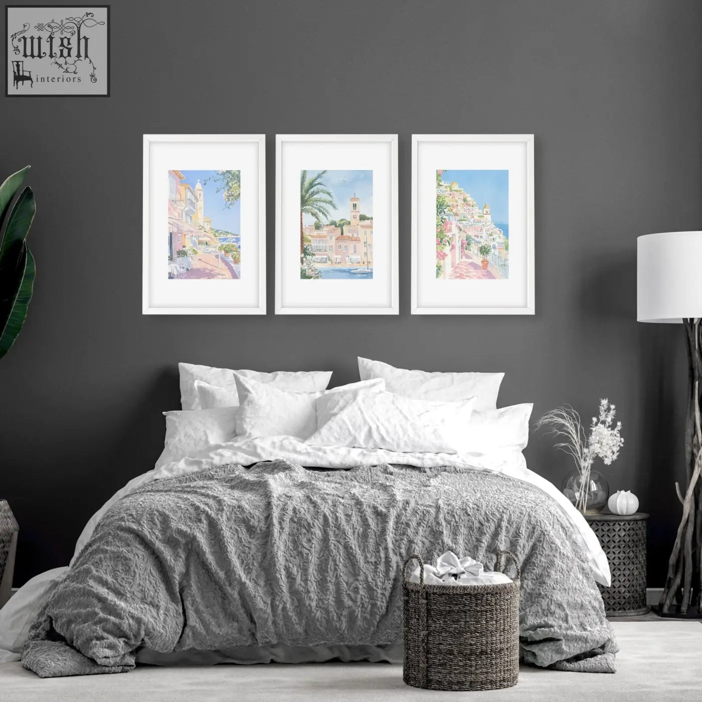Woven wicker laundry basket with handles shown alongside set of 3 beach decor wall art for above the bed wall decor