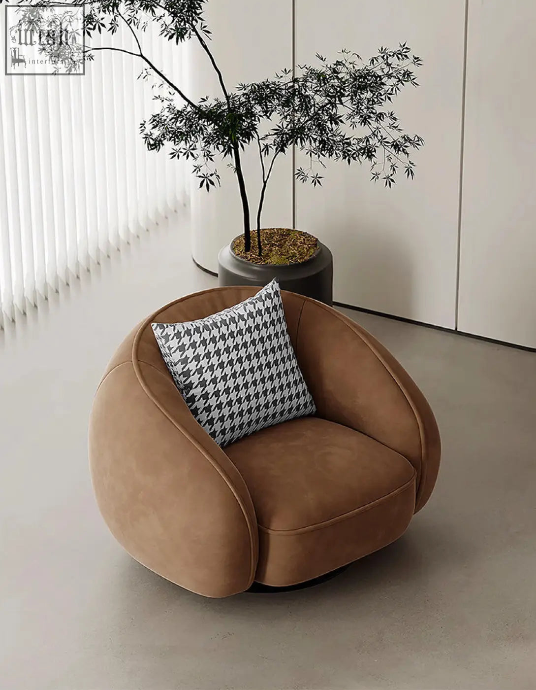 A cozy tan suede abreu swivel accent round armchair with a black and white houndstooth pillow