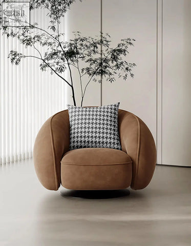 Tan suede abreu swivel accent chair round armchair with black and white houndstooth pillow for stylish seating