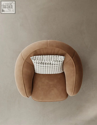 Tan suede round armchair with houndstooth cushion featuring the abreu swivel accent chair design