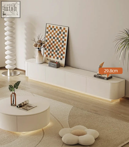 Cream tv stand absinthia with sleek curved edges and integrated led lighting offers financing and low shipping cost