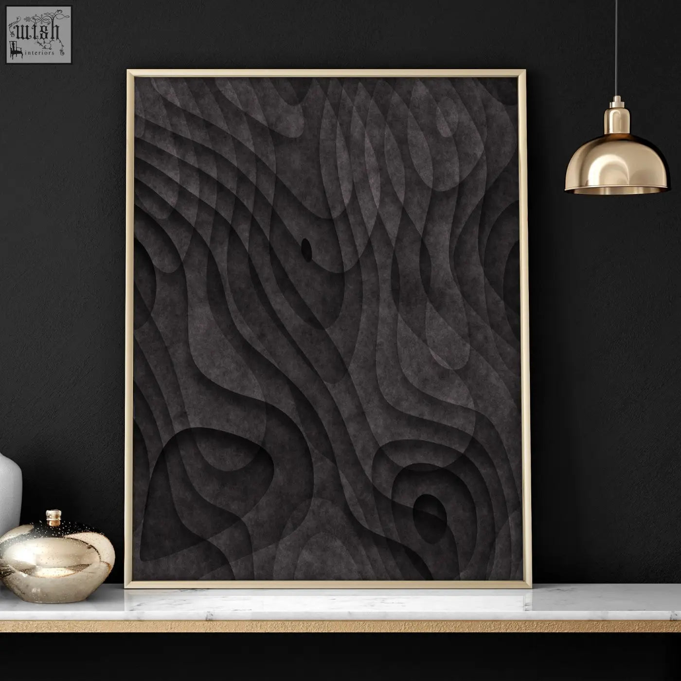 A framed abstract artwork print with dark charcoal textured topographic wave patterns in a thin gold frame
