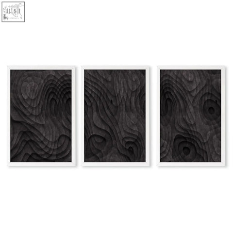Three framed abstract artwork dark charcoal topographic wave wood pieces with layered textured surfaces wall art prints