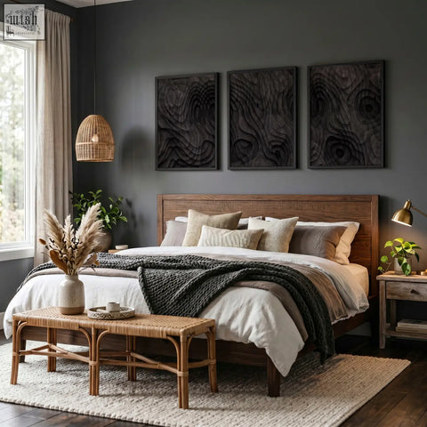 Wooden bed with dark brown finish and neutral pillows below abstract artwork dark charcoal topographic wave prints set of 3
