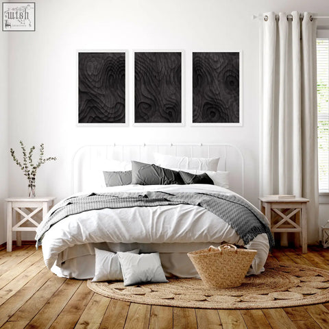 Woven wicker basket with natural tan hue and sturdy handles alongside abstract artwork dark charcoal topographic wave prints set of 3