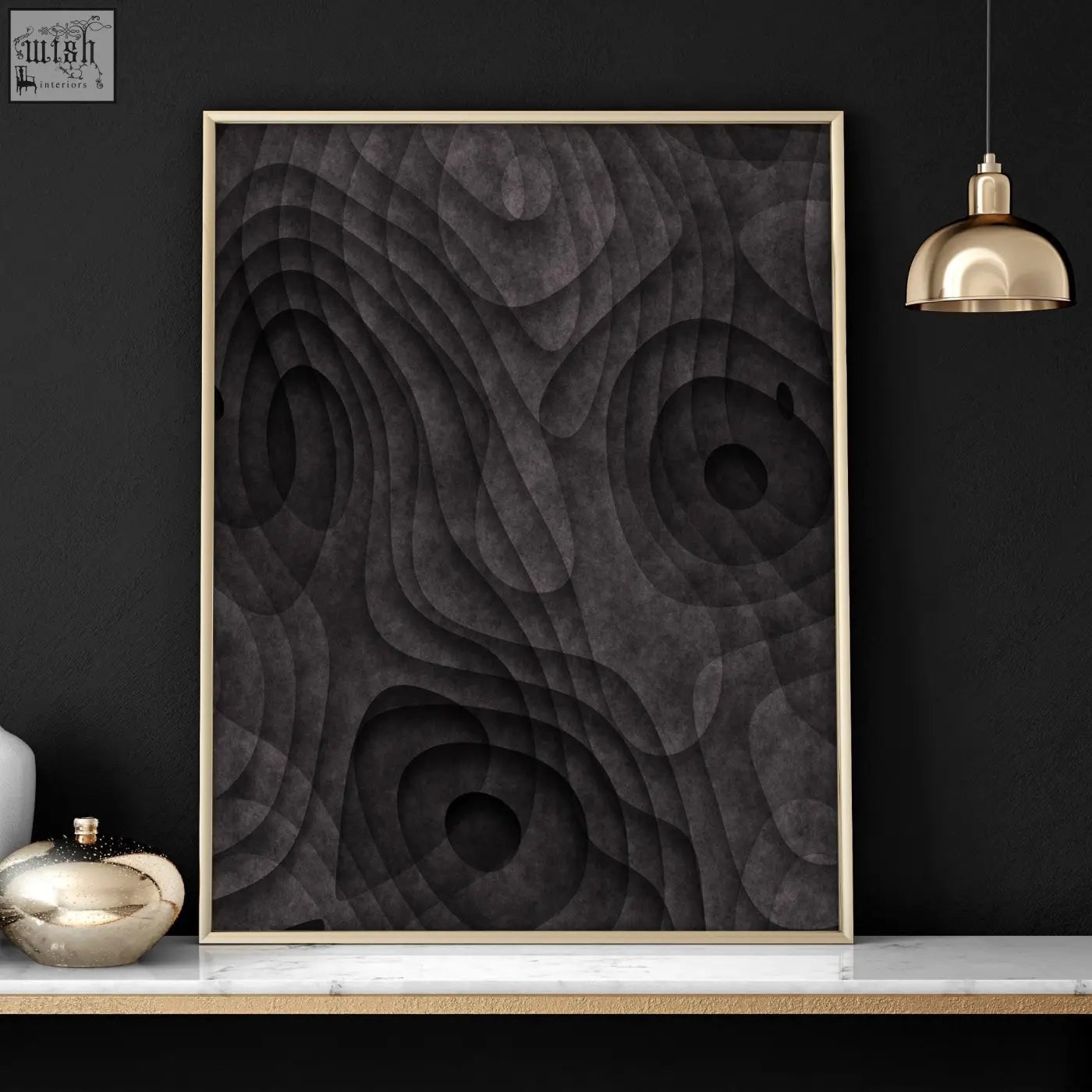 A modern abstract artwork print with dark charcoal topographic wave patterns in a sleek gold-toned frame