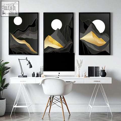 Three black-framed abstract landscape wall art prints featuring gold and white geometric mountain designs