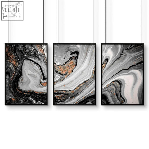 Set of 3 black-framed abstract wall art prints with gray white and metallic copper marbled patterns for living room decor