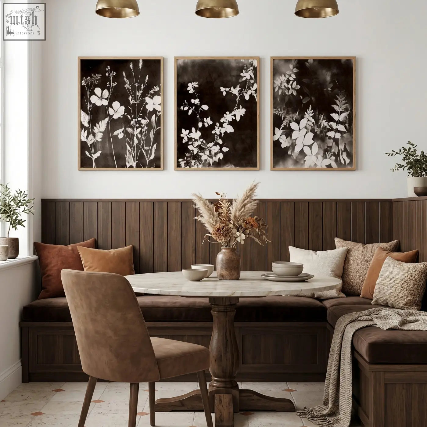 Round marble-top dining table with dark wood pedestal base perfect for dining room with abstract nature art prints