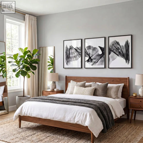 Wooden bed with warm brown finish and simple headboard with matching nightstands next to abstract painting art print set