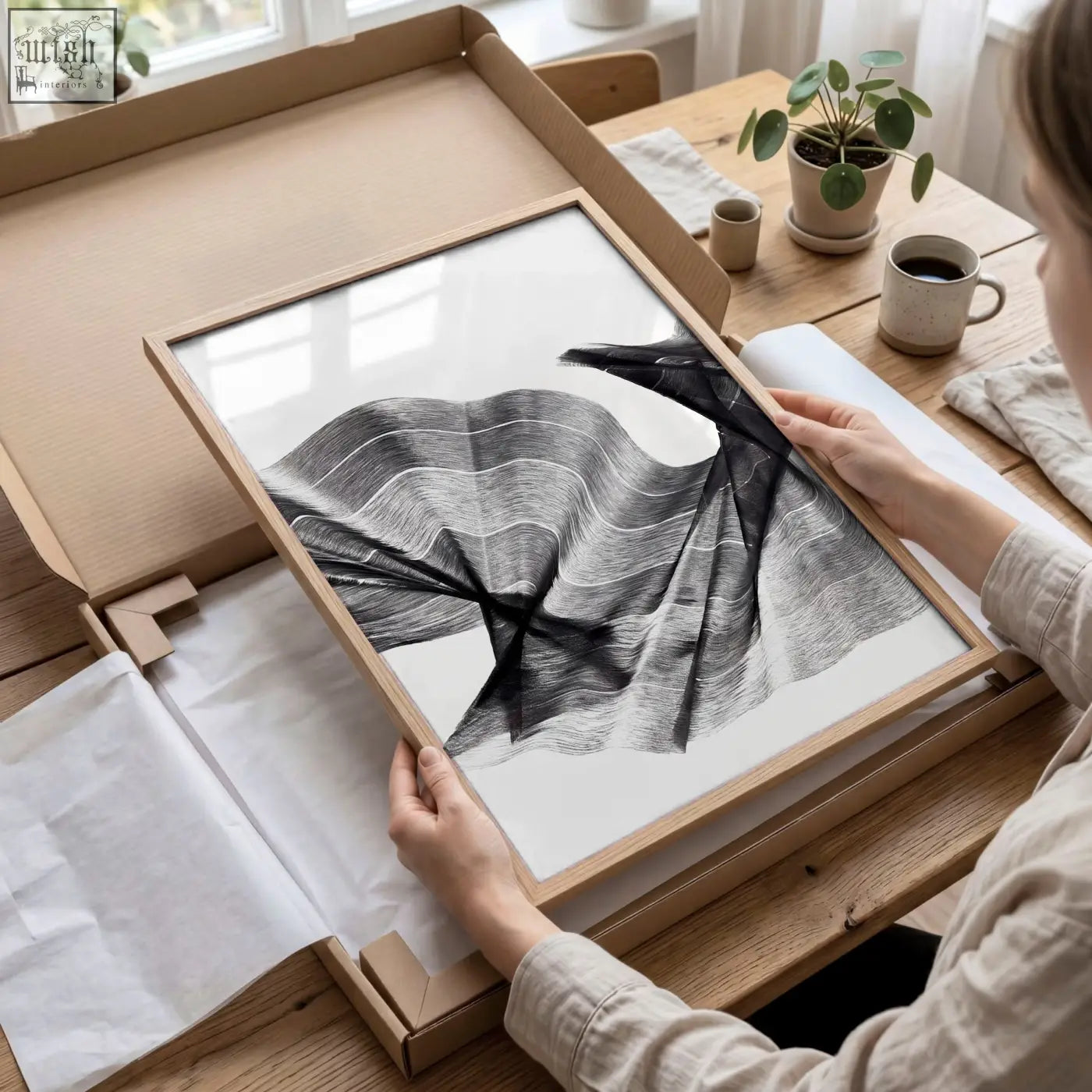 A minimalist black and white abstract painting art print with flowing charcoal lines in a light wood frame set of 3