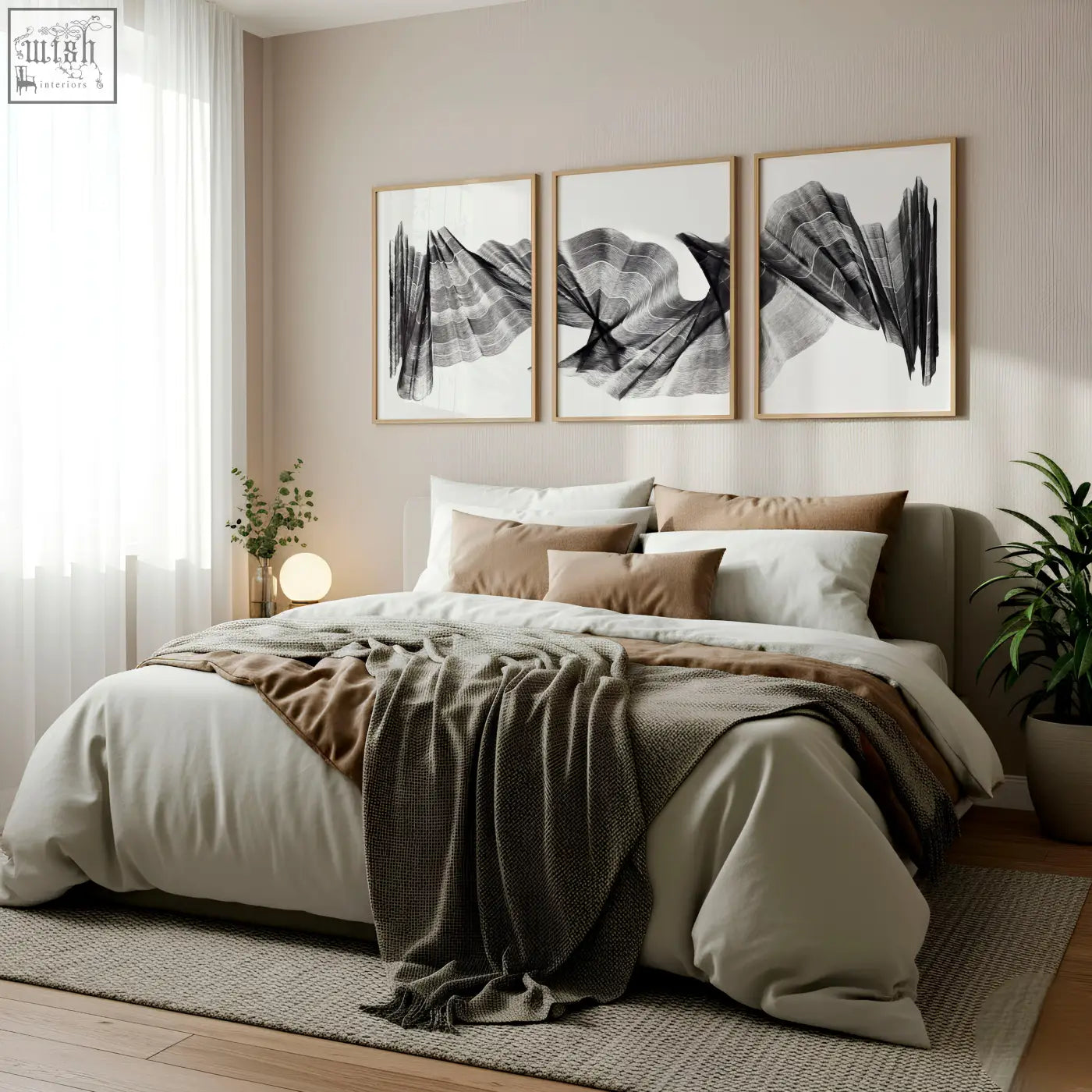 A cozy bed with soft beige and brown linens and a dark green throw featuring an abstract painting art print set of 3