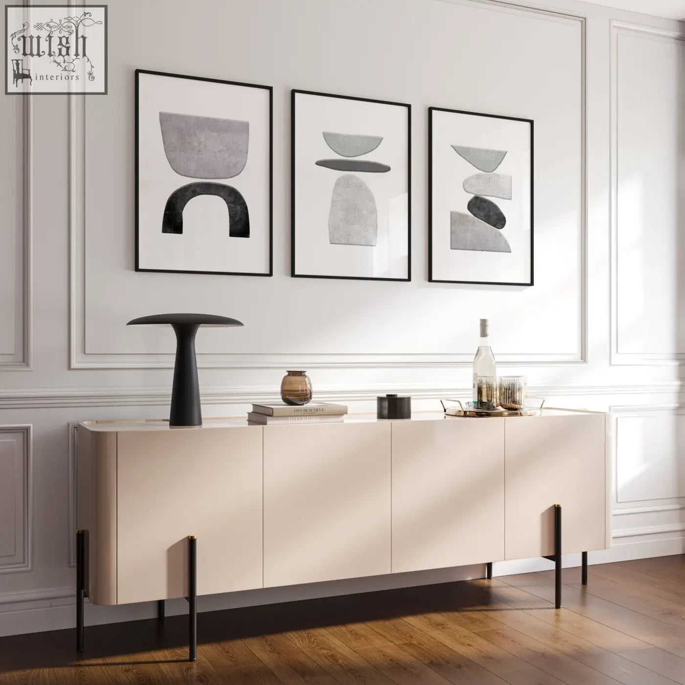 Cream-colored sideboard with sleek black metal legs paired with abstract black and white wall art prints set of 3