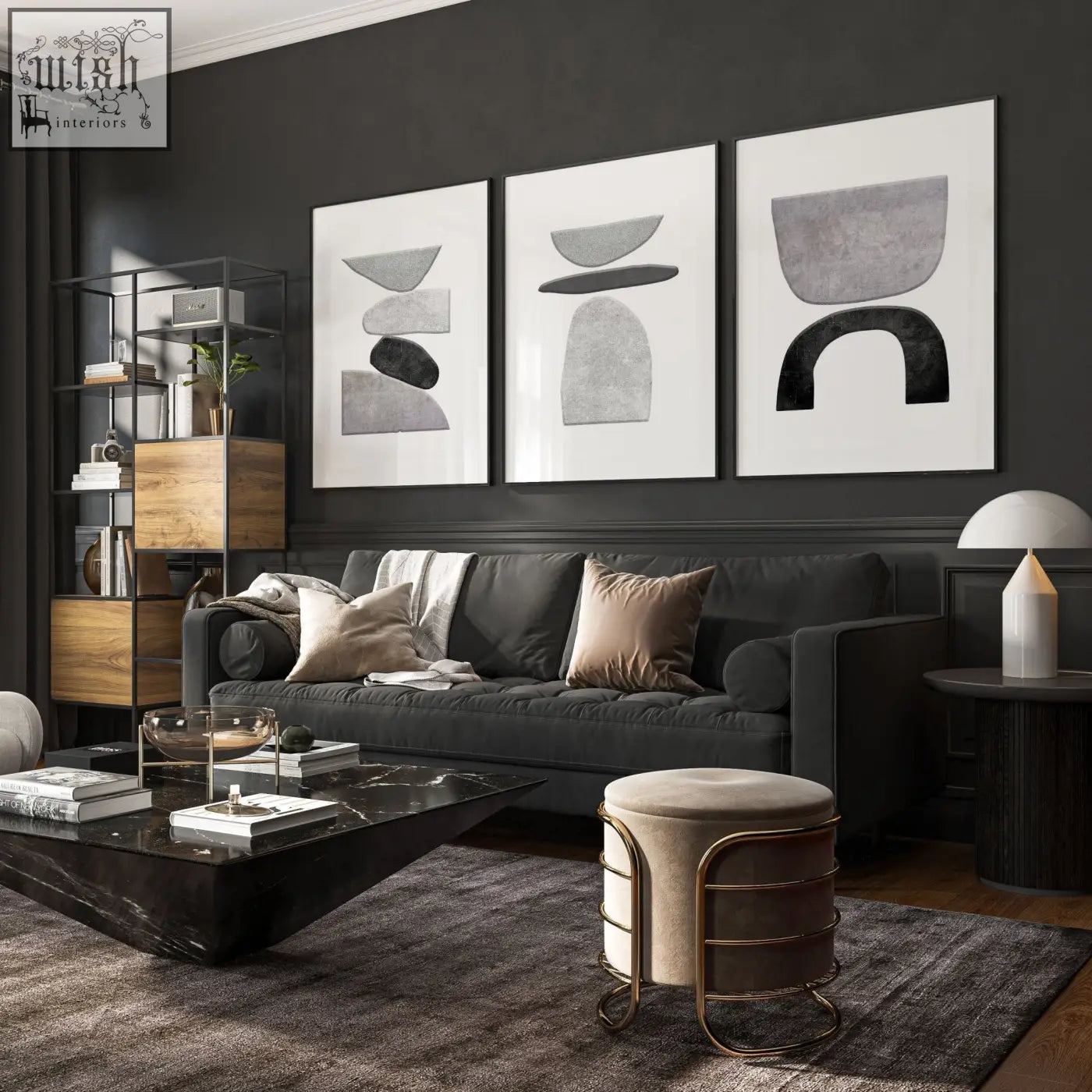 Dark gray velvet sofa with plush cushions and modern design below abstract black and white wall art prints set of 3