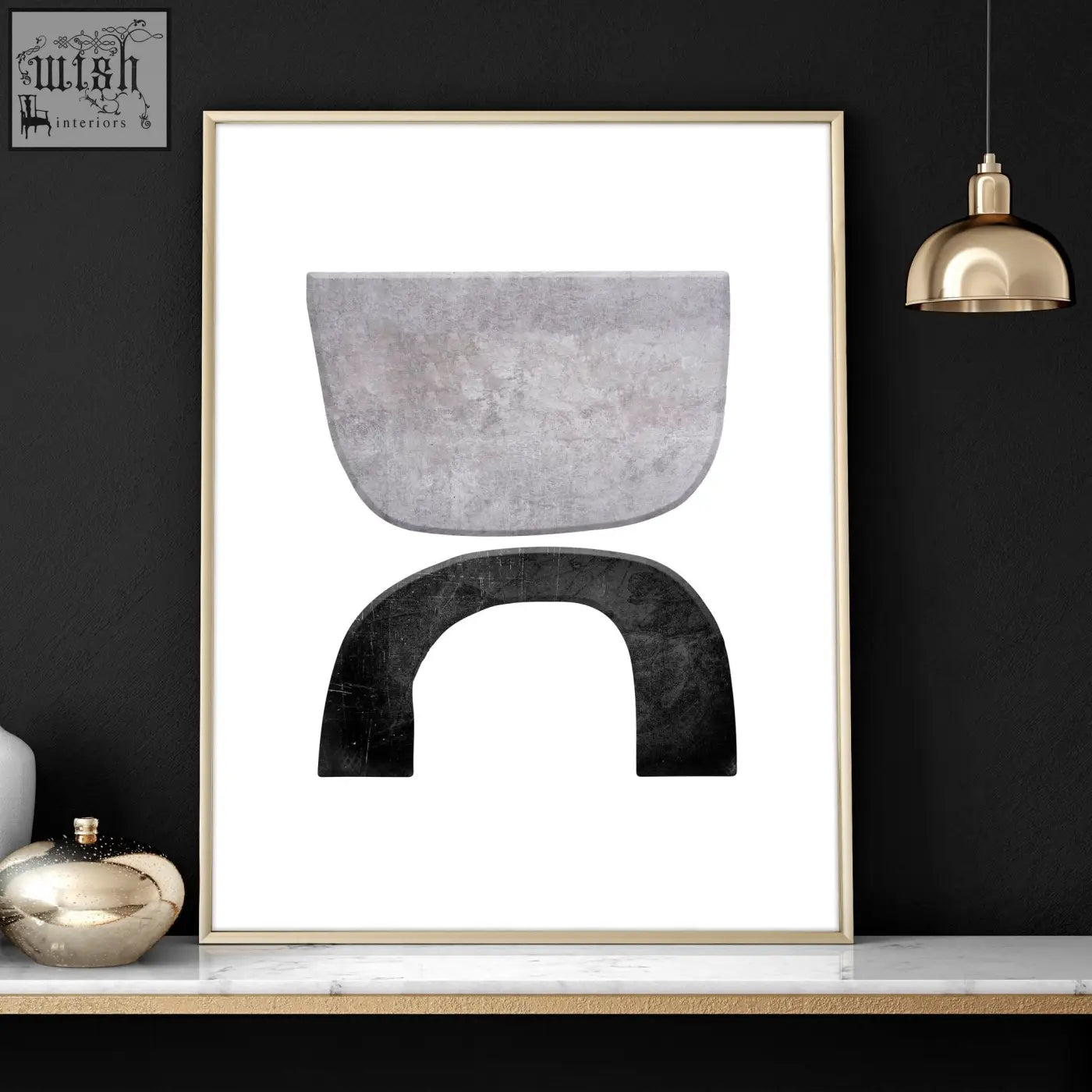 Modern abstract wall art print with two curved textured shapes in gray and black framed in gold-toned frame