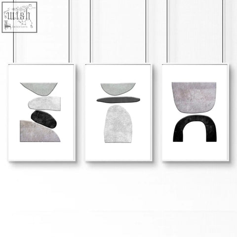 Set of three minimalist abstract wall art prints featuring stacked geometric shapes in muted gray black and white tones